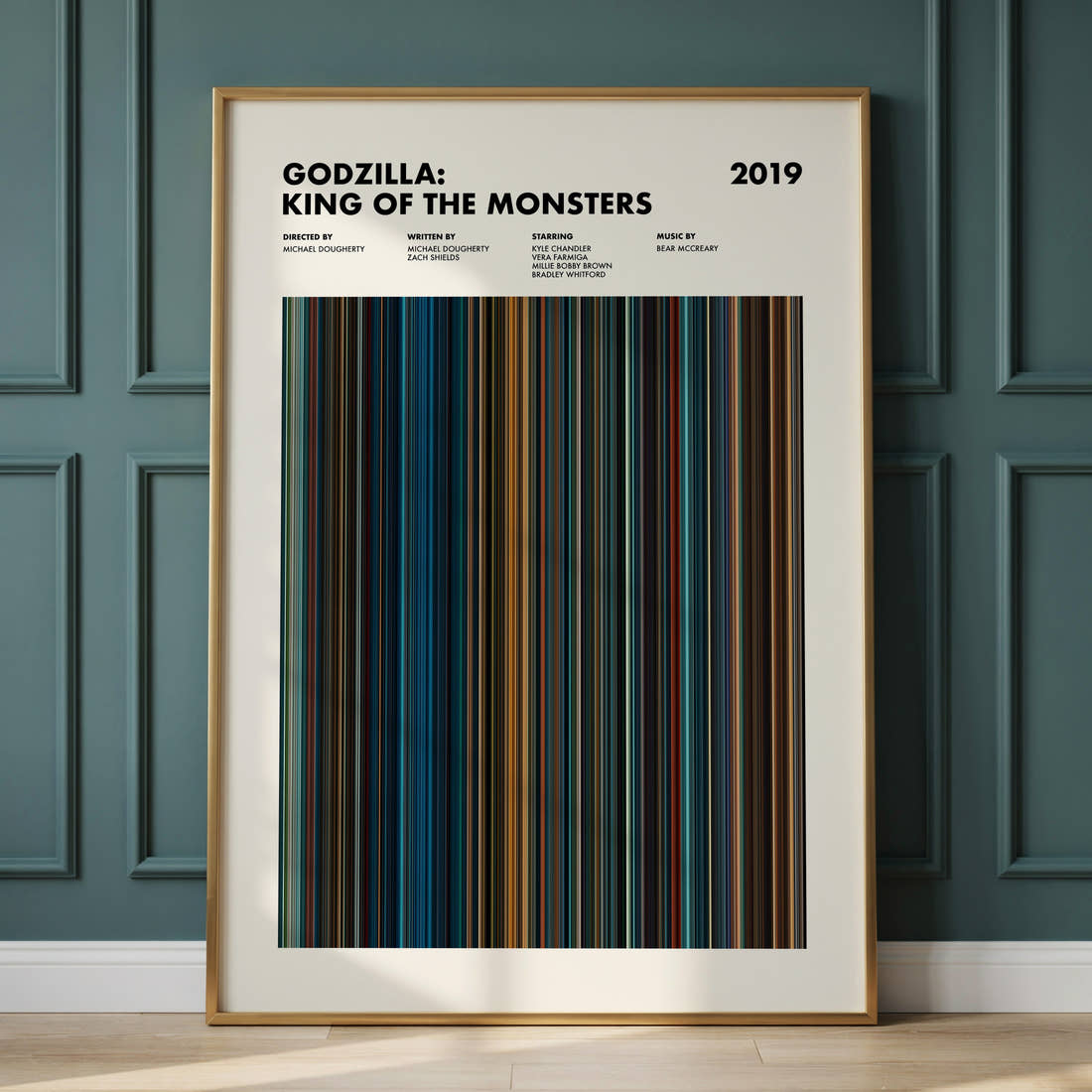 Godzilla King of the Monsters Movie Barcode Poster framed and leaning against a panelled wall