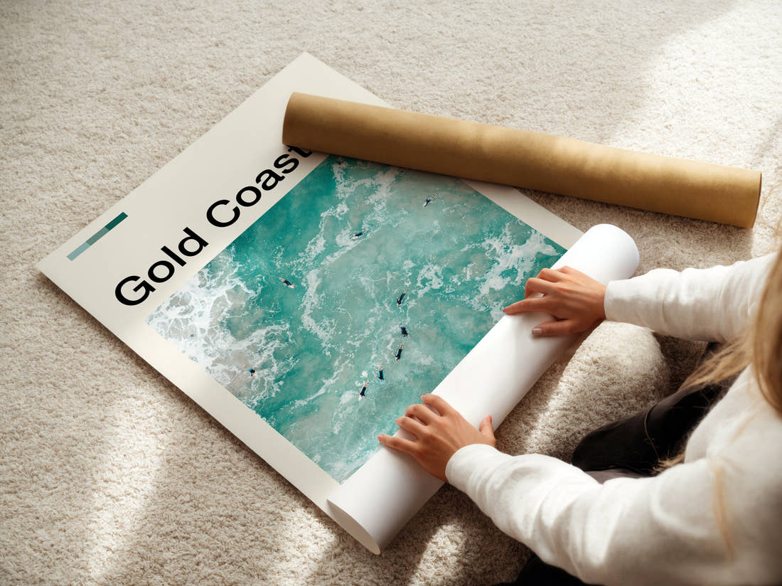 Gold Coast Surfers In The Waves Travel Print being unrolled from its postal tube