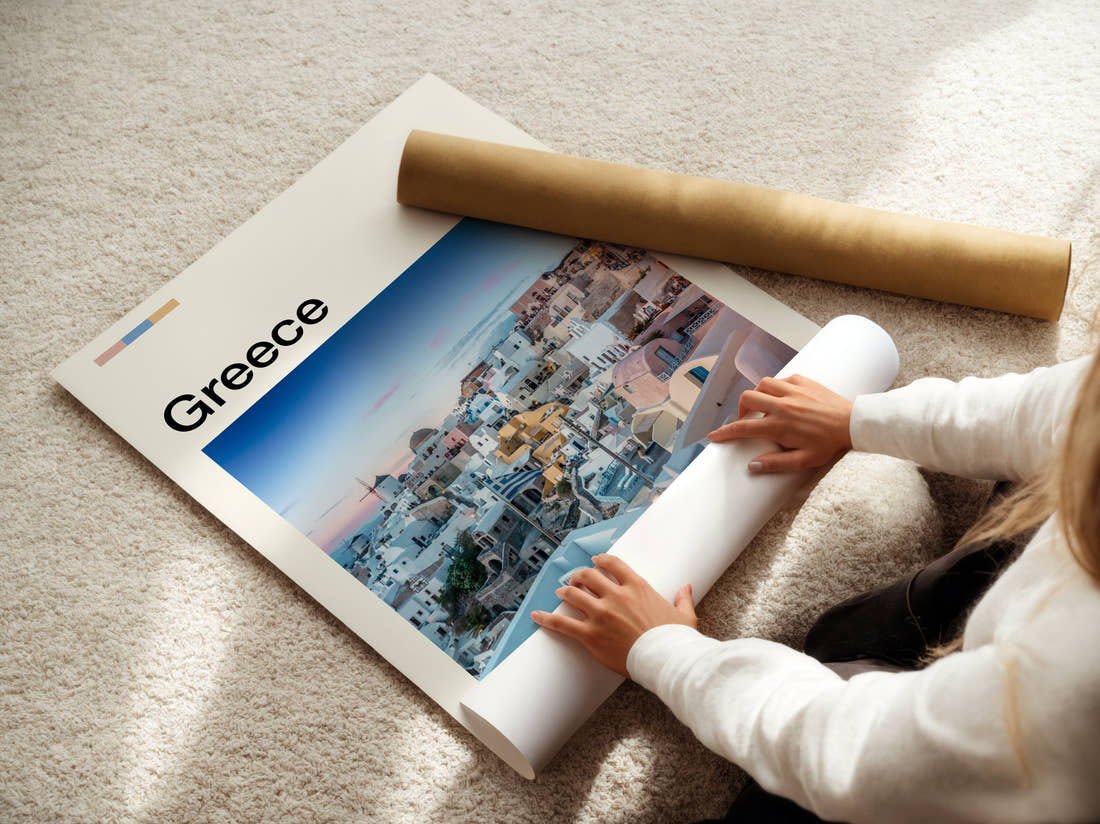 Greece Whitewashed Cliffside Village Travel Print being unrolled from its postal tube