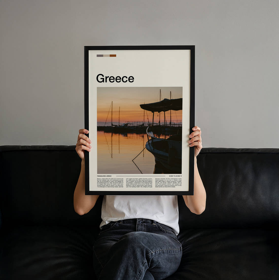 Greece Boat At Sunset Travel Print held up by hand to show the size of the print
