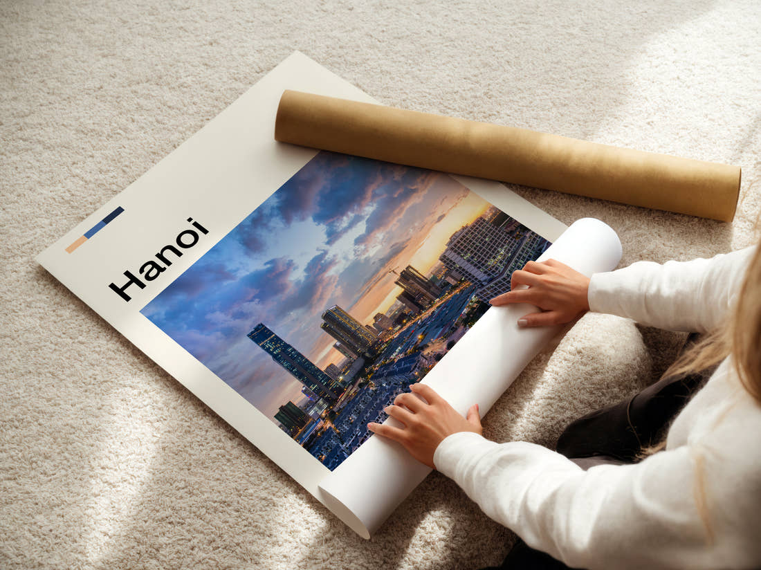 Hanoi Skyline At Dusk Travel Print being unrolled from its postal tube