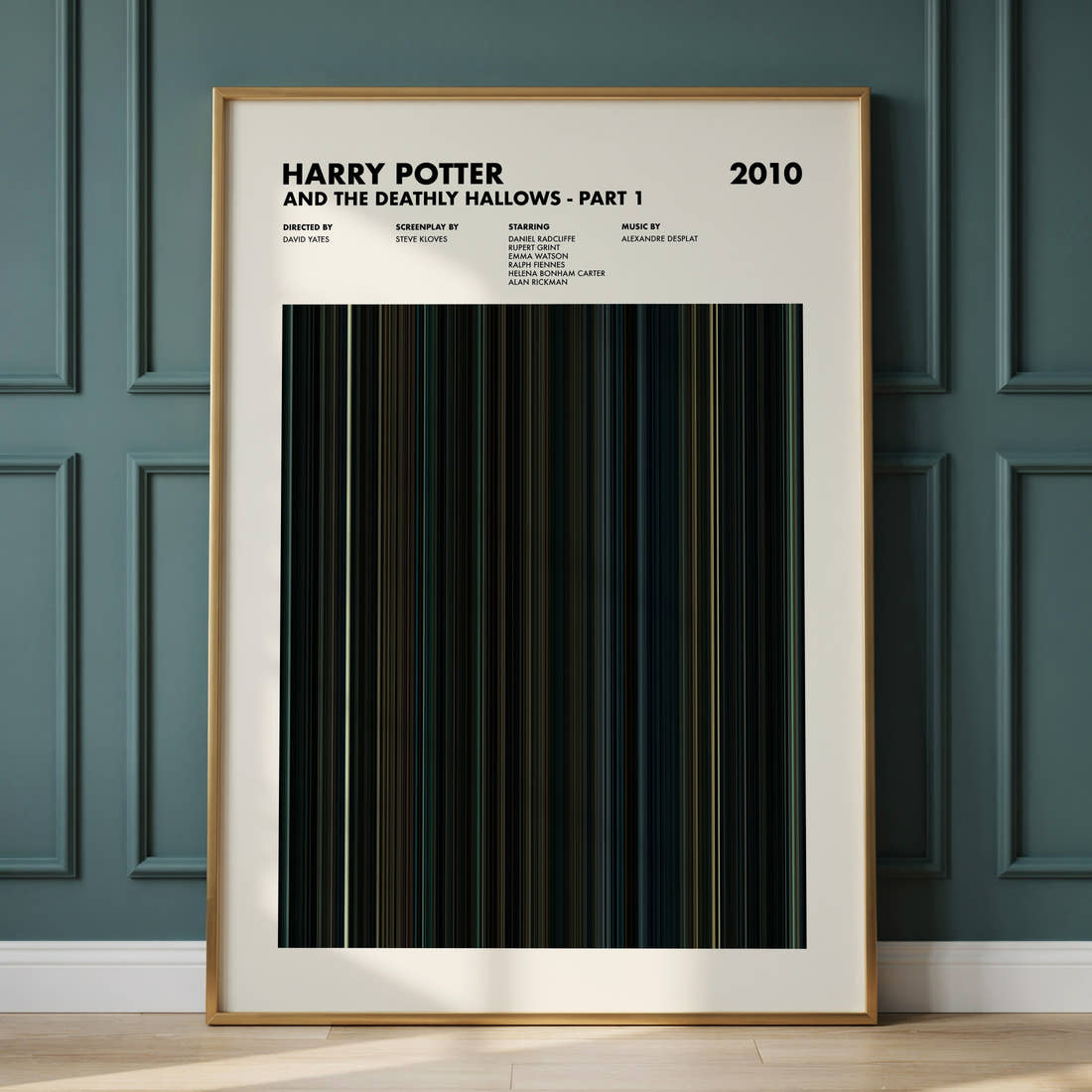 Harry Potter and the Deathly Hallows Part 1 Movie Barcode Poster framed and leaning against a panelled wall