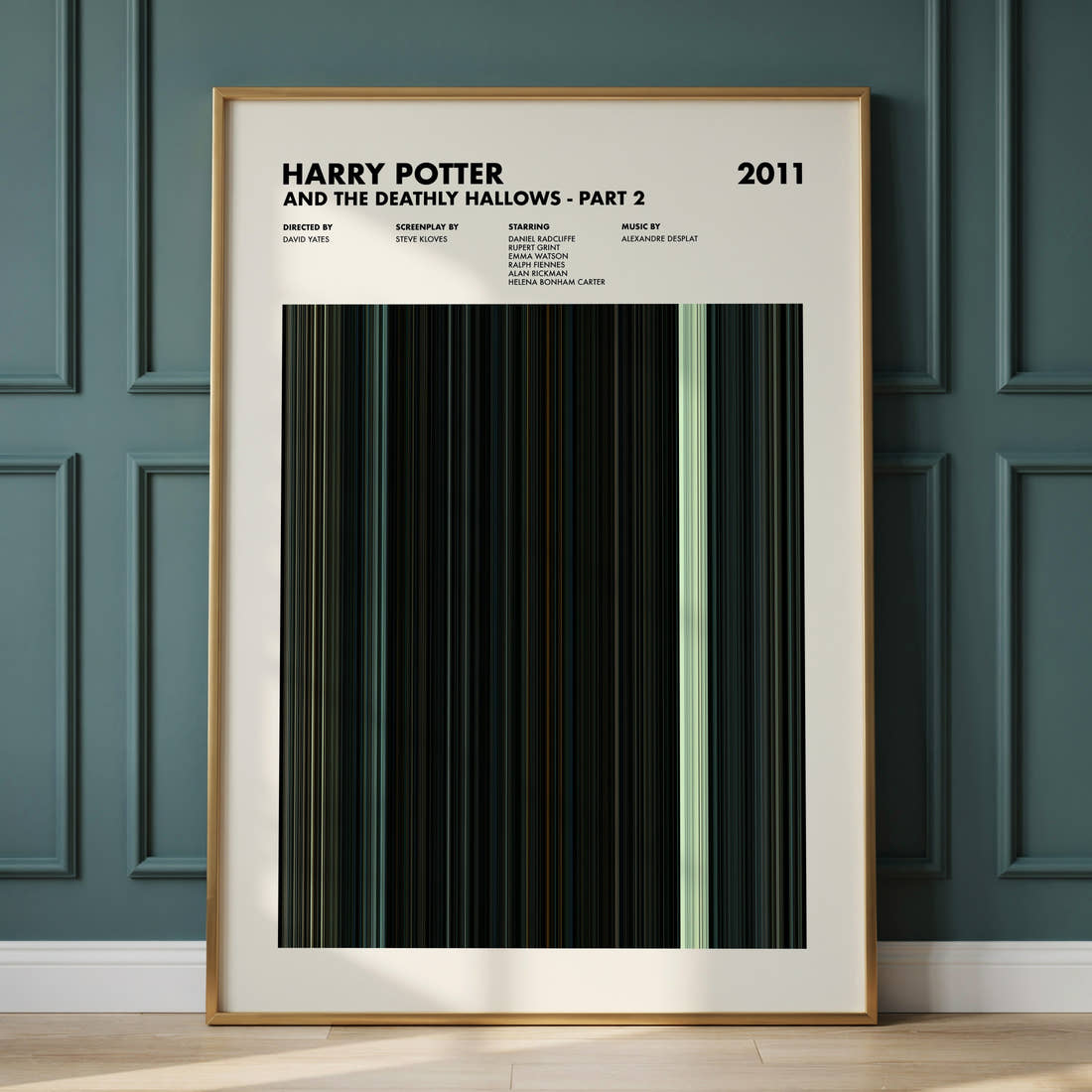 Harry Potter and the Deathly Hallows Part 2 Movie Barcode Poster framed and leaning against a panelled wall