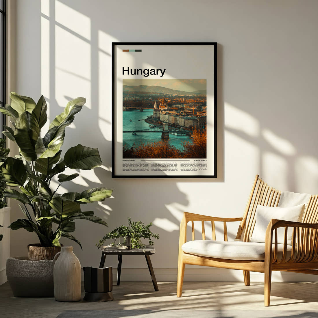 Hungary Parliament And Chain Bridge Travel Print framed on a pale wall beside houseplants