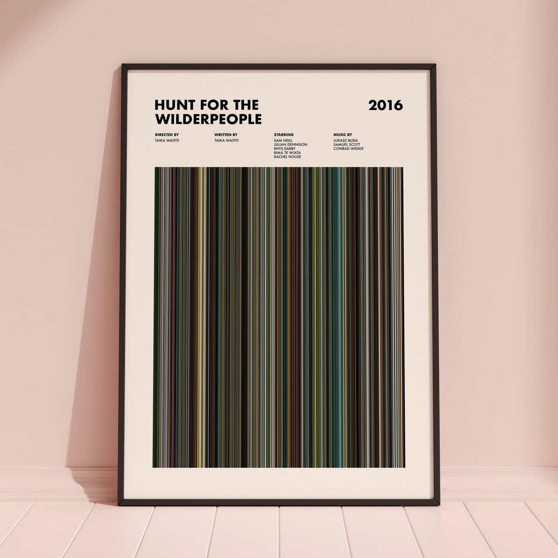 Hunt for the Wilderpeople Movie Barcode Poster framed and leaning against a coloured wall