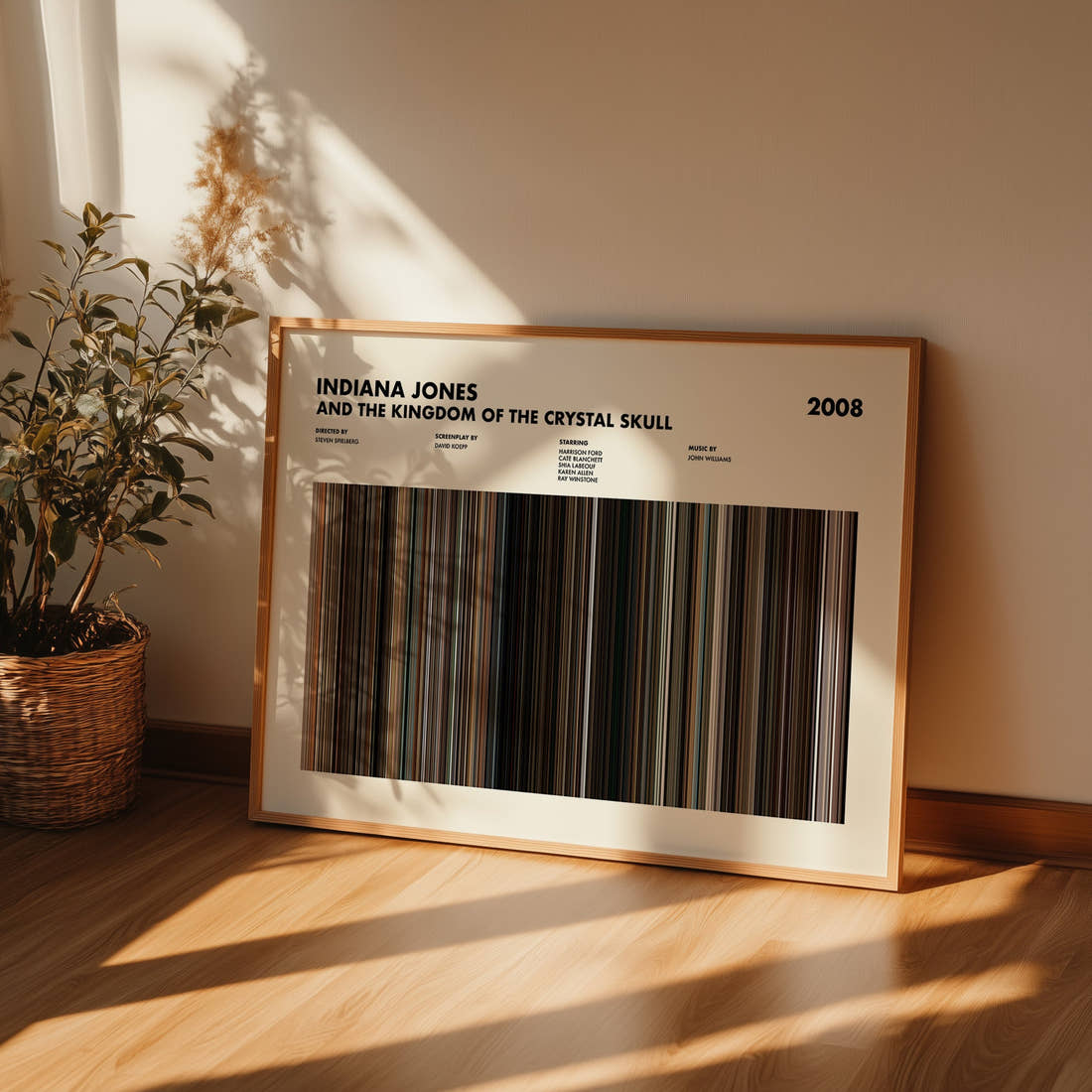 Indiana Jones and the Kingdom of the Crystal Skull Movie Barcode Poster framed and leaning against a wall on a wooden floor