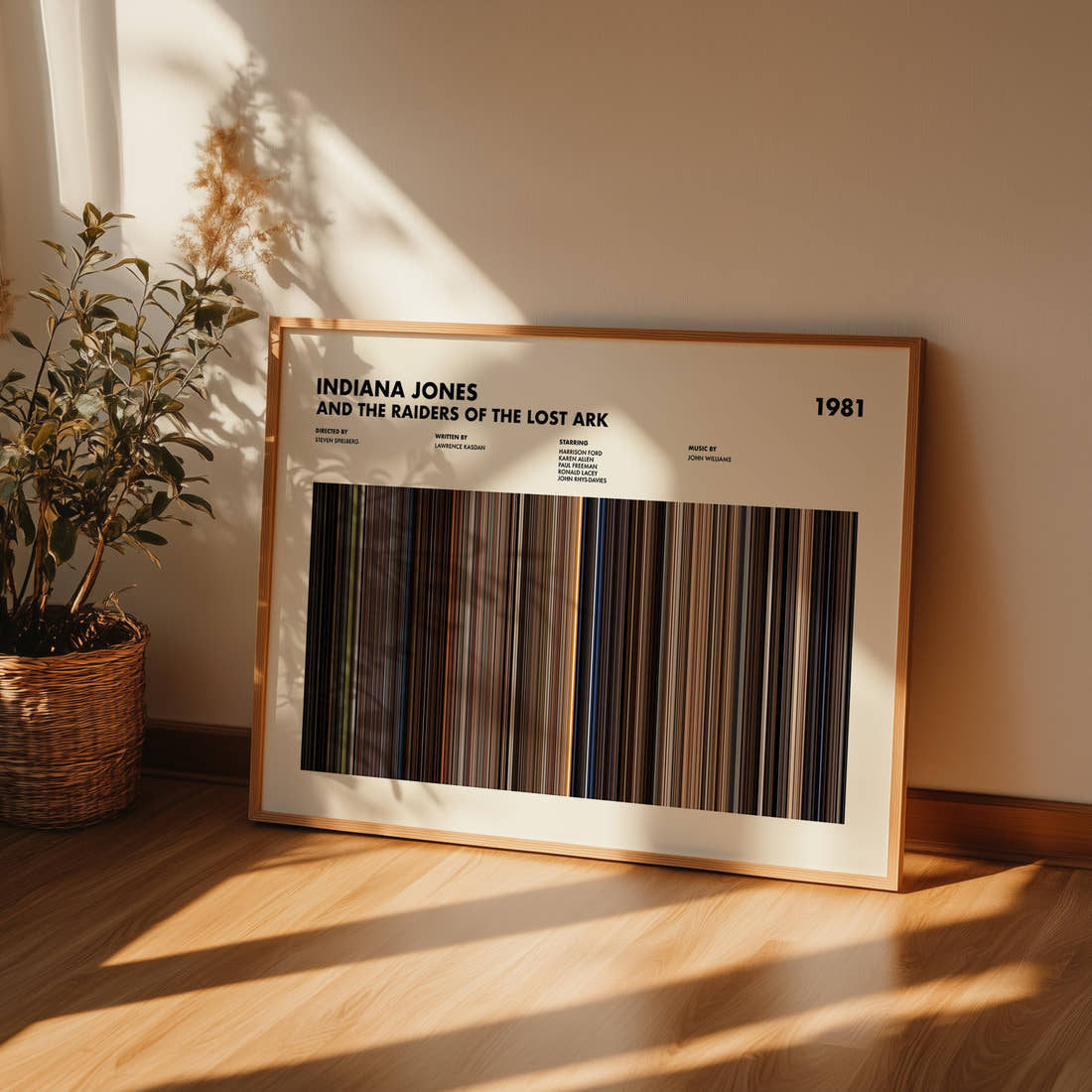 Indiana Jones and the Raiders of the Lost Ark Movie Barcode Poster framed and leaning against a wall on a wooden floor