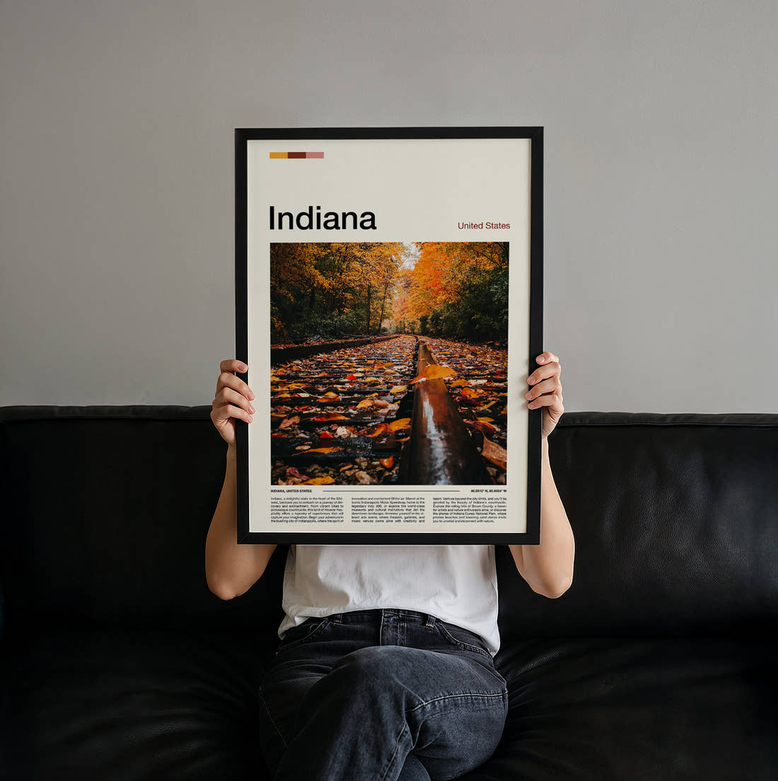 Indiana Autumn Leaves On Tracks Travel Print held up by hand to show the size of the print