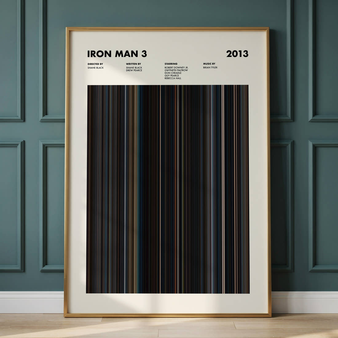 Iron Man 3 Movie Barcode Poster framed and leaning against a panelled wall