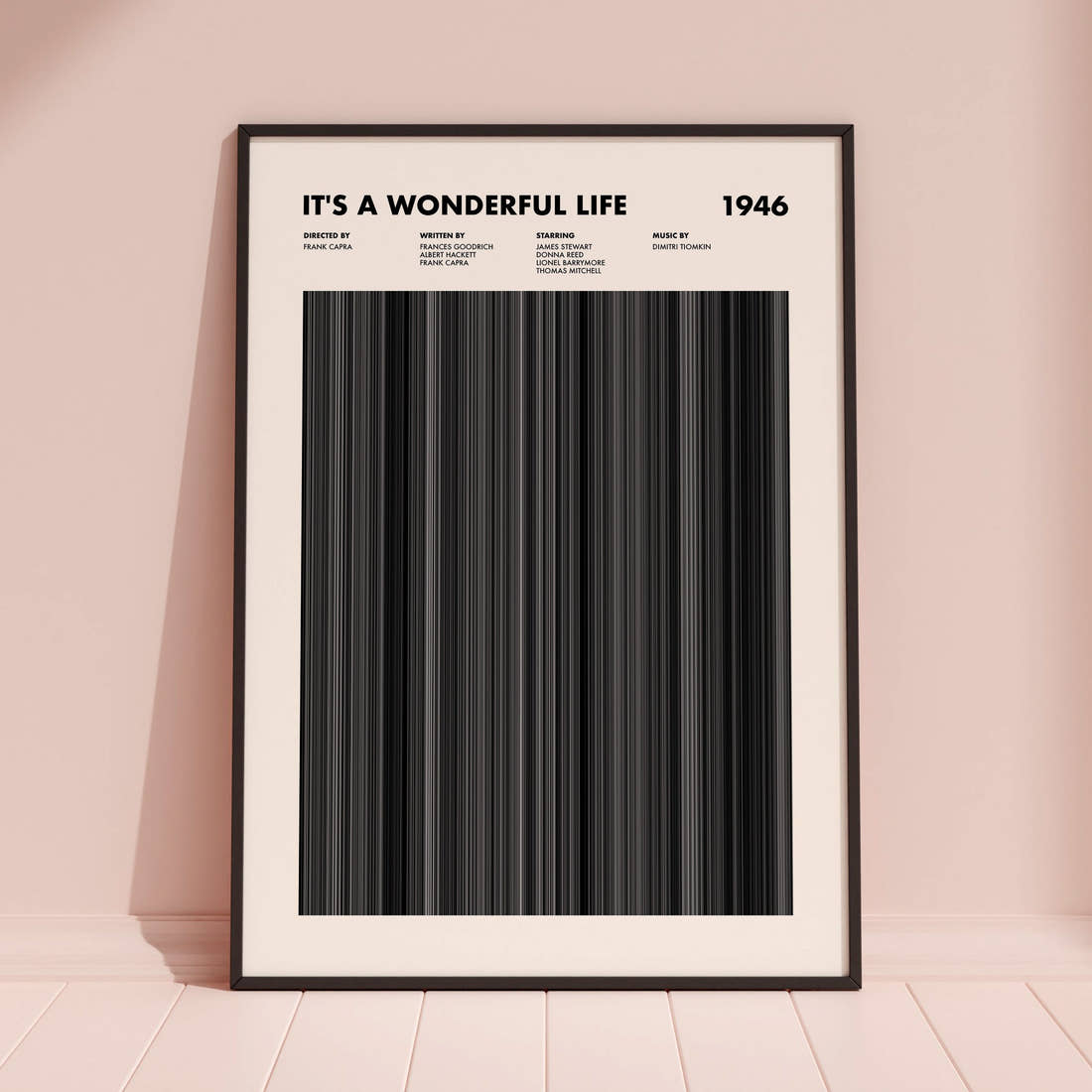 It's A Wonderful Life Movie Barcode Poster framed and leaning against a coloured wall