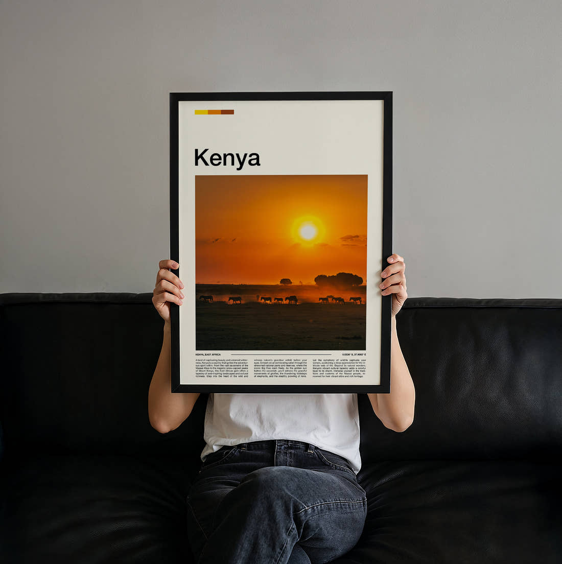 Kenya Herd At Sunset Travel Print held up by hand to show the size of the print
