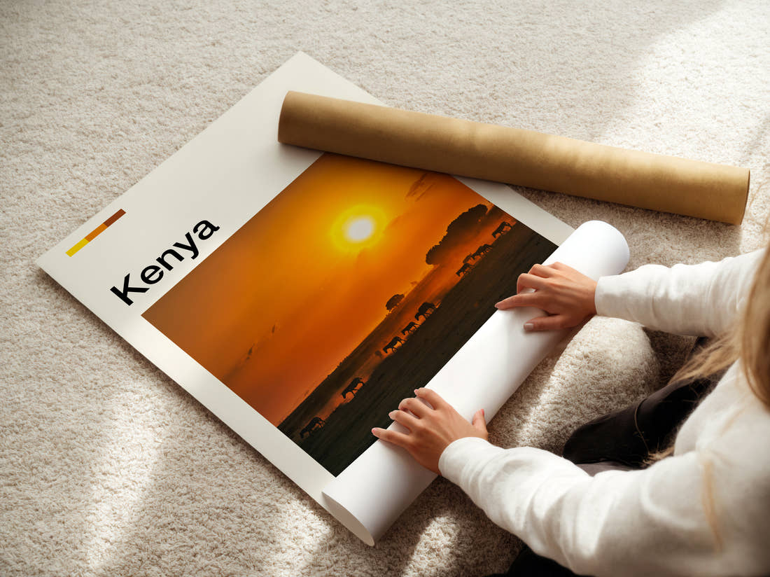 Kenya Herd At Sunset Travel Print being unrolled from its postal tube