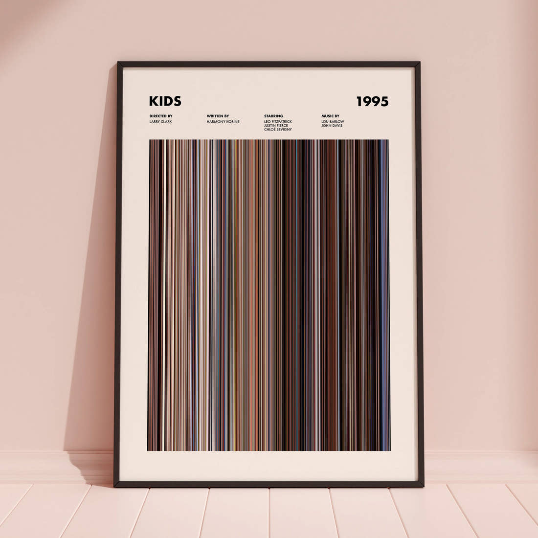 Kids Movie Barcode Poster framed and leaning against a coloured wall