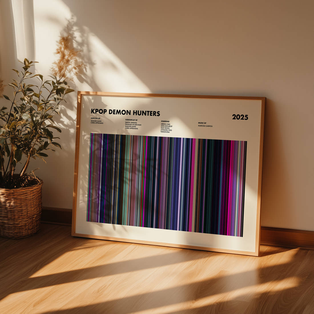 KPop Demon Hunters Movie Barcode Poster framed and leaning against a wall on a wooden floor