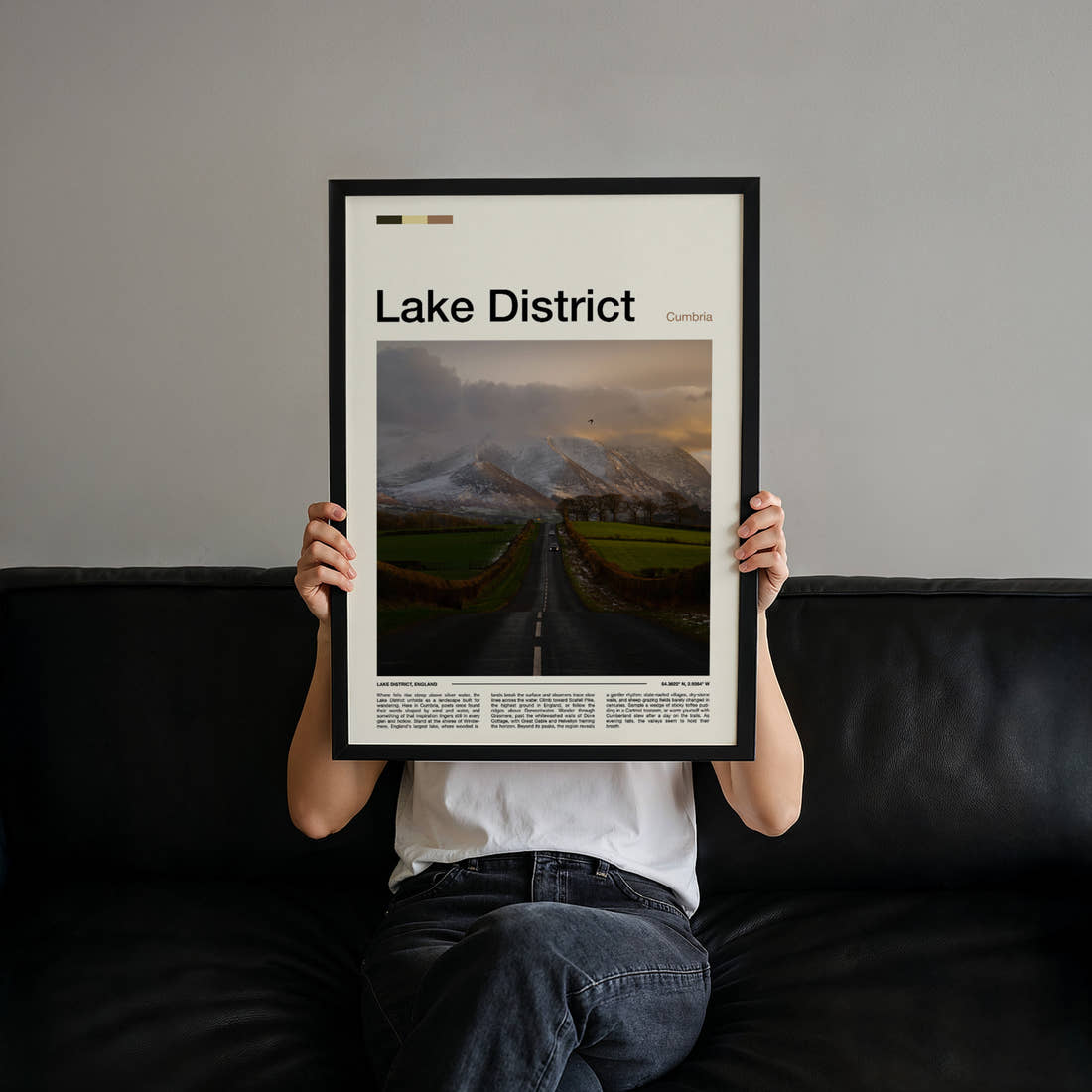 Lake District Fell Road At Dusk Travel Print held up by hand to show the size of the print