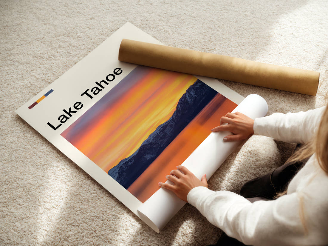 Lake Tahoe Orange Sunset Over Mountains Travel Print being unrolled from its postal tube