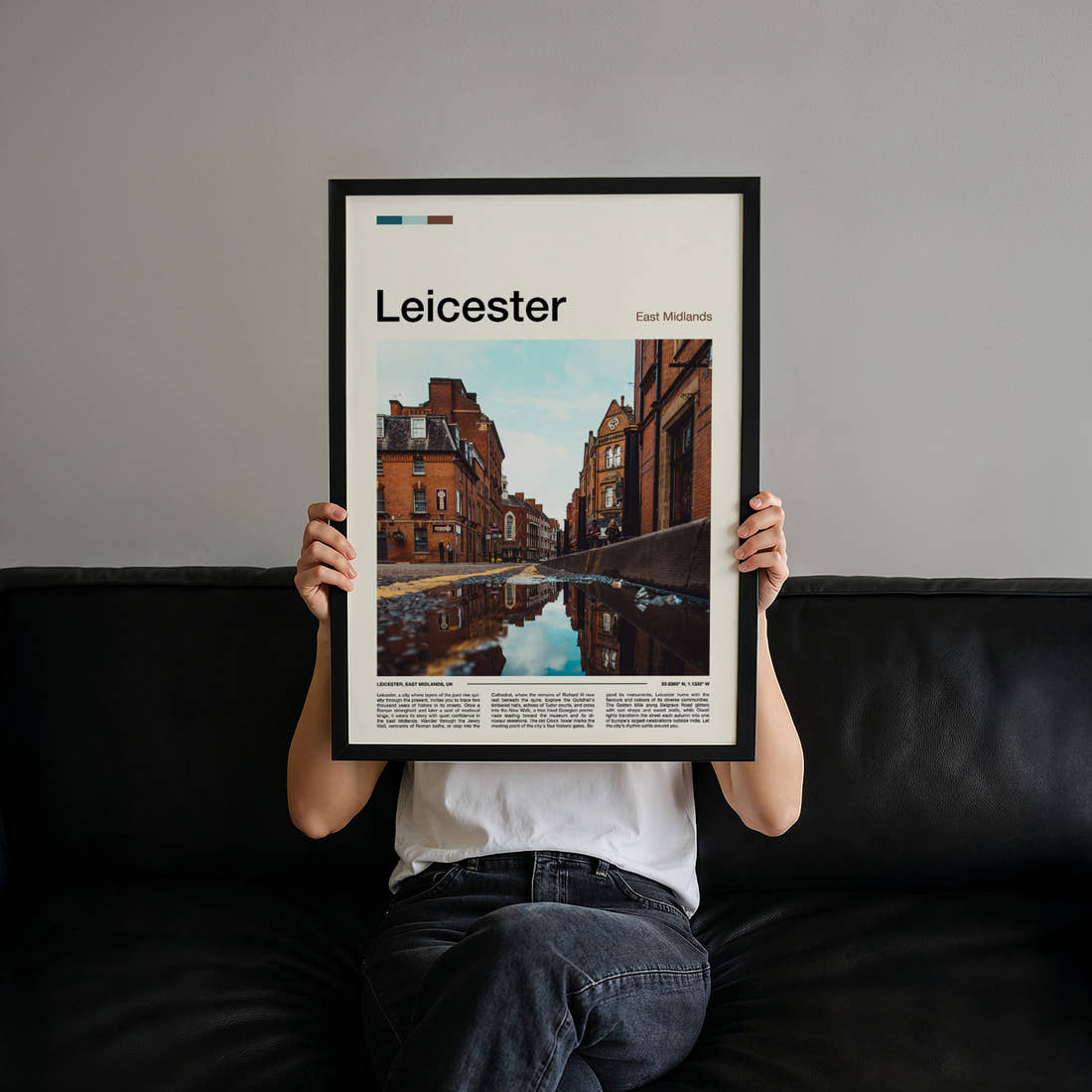 Leicester Cobbled Street Reflection Travel Print held up by hand to show the size of the print
