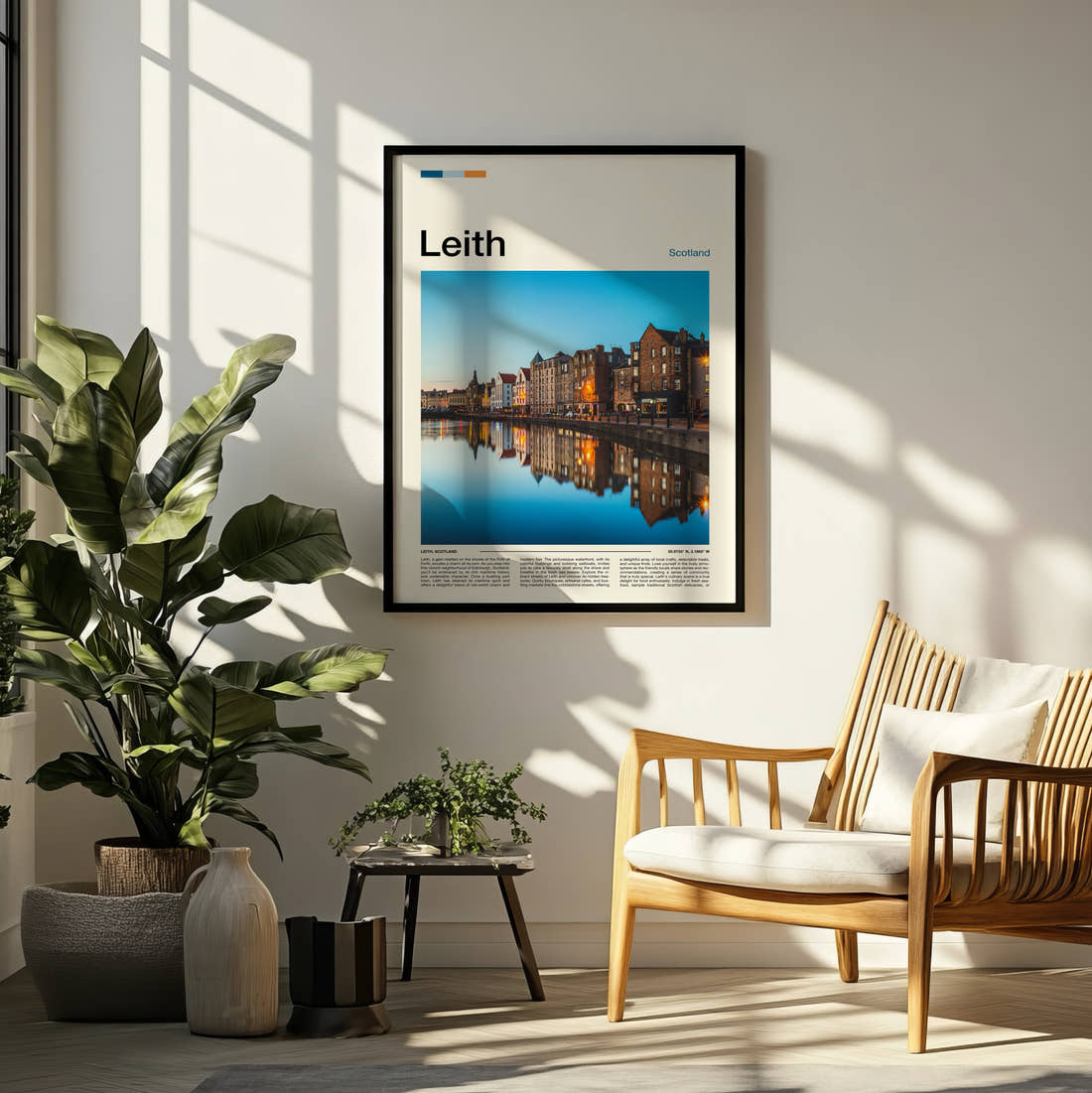 Leith Waterfront Buildings Reflected Travel Print framed on a pale wall beside houseplants