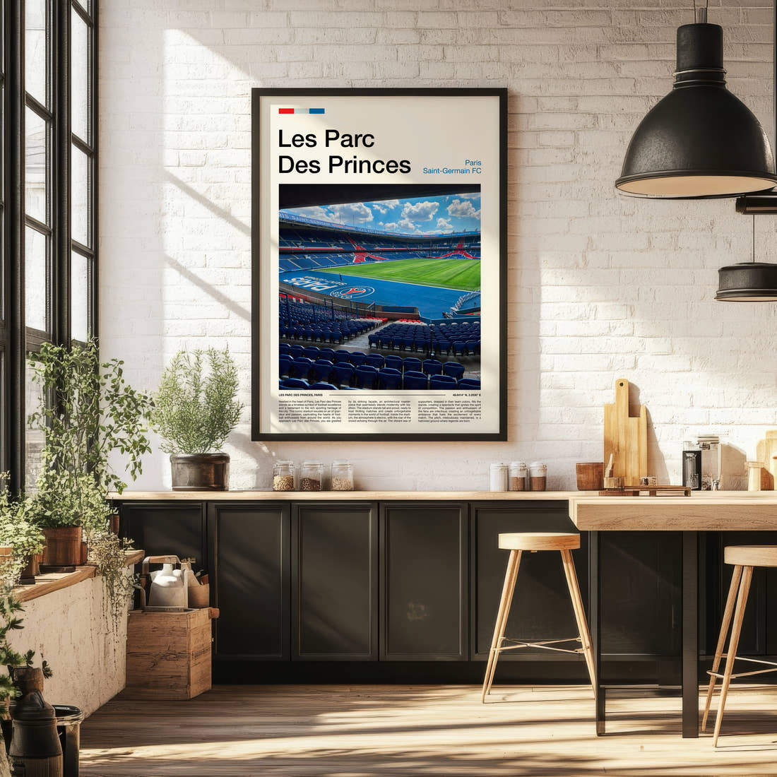 Les Parc Des Princes Stadium Print framed on the wall of a bright kitchen and dining space