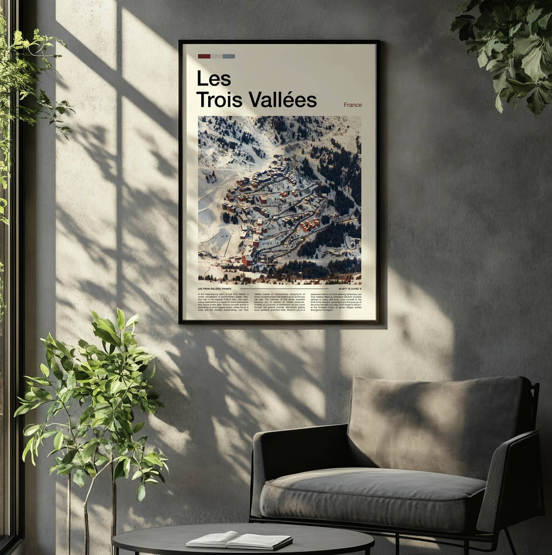Les Trois Vallees Snowy Ski Village Travel Print framed on the wall of a relaxed living room