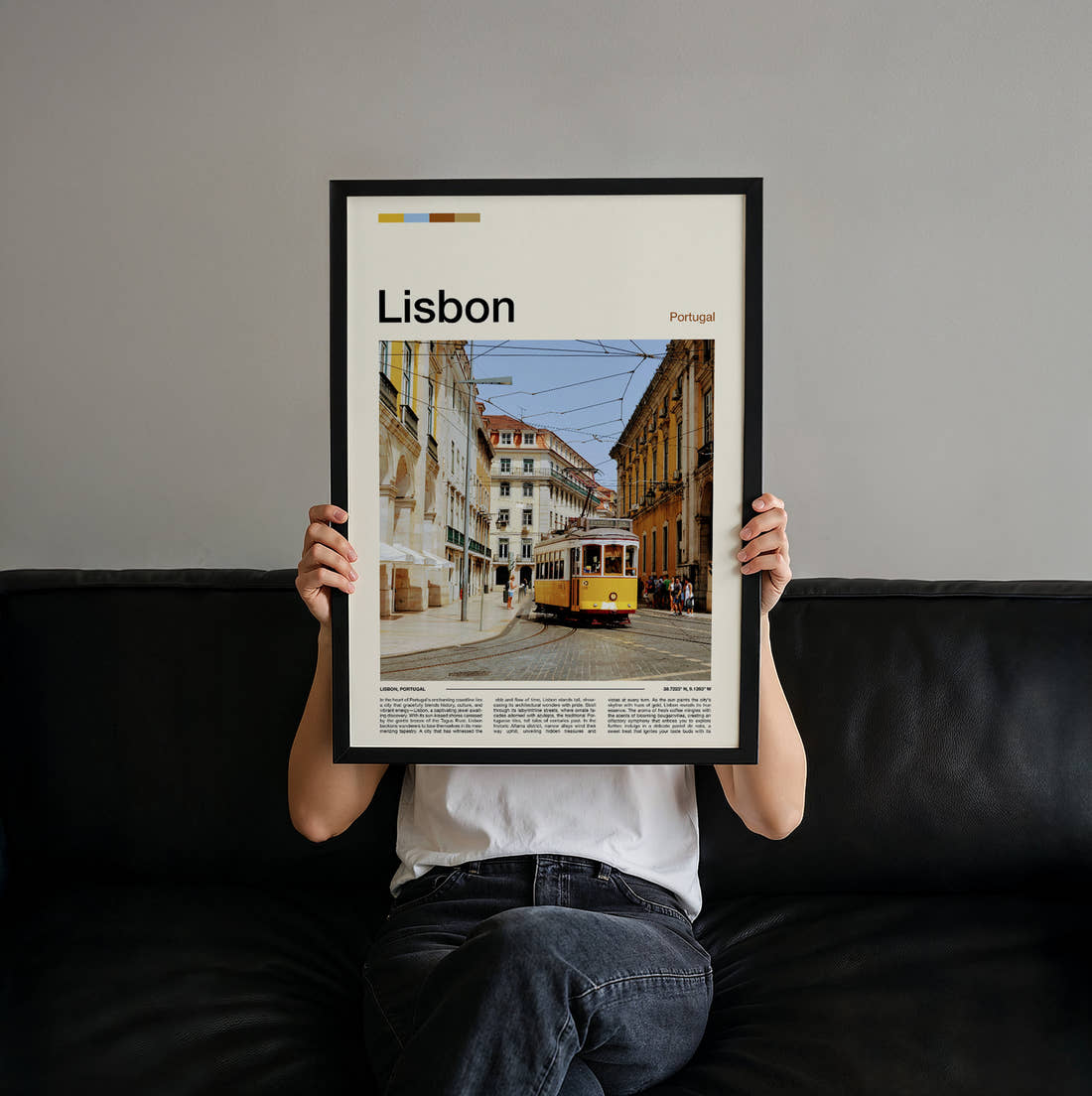 Lisbon Yellow Tram In The Square Travel Print held up by hand to show the size of the print