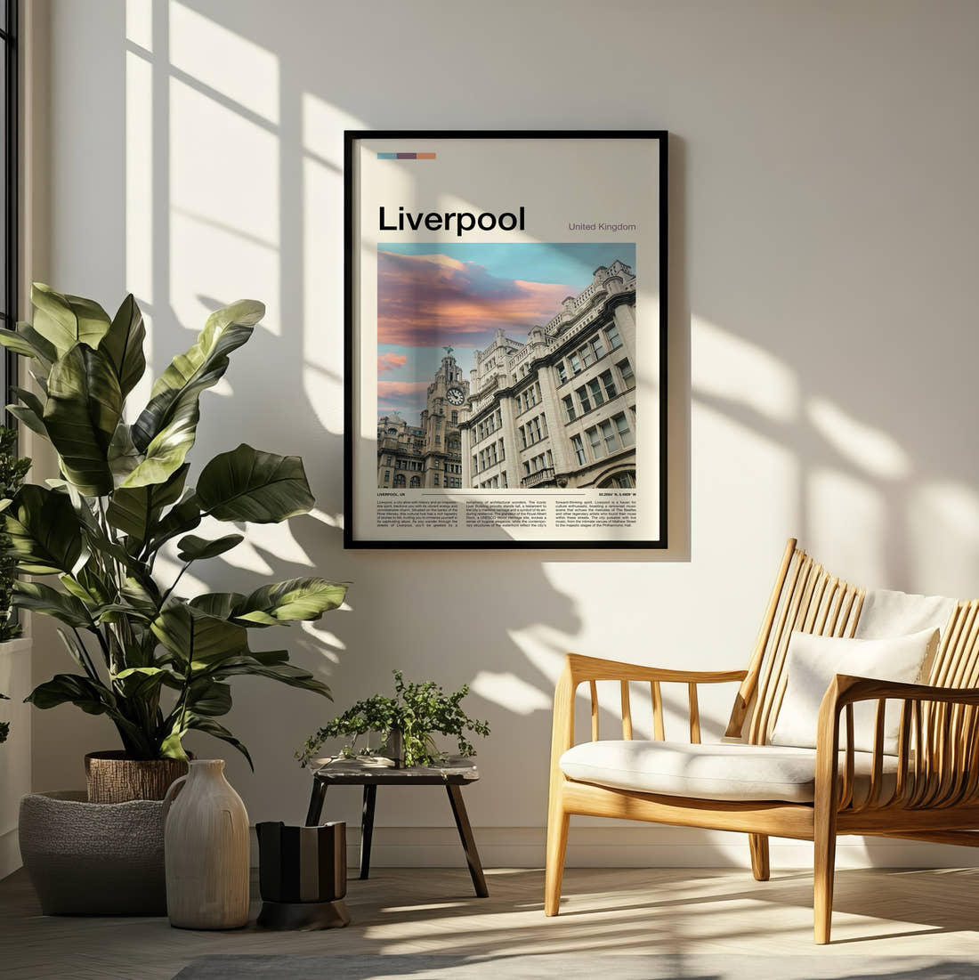 Liverpool Royal Liver Building At Sunset Travel Print framed on a pale wall beside houseplants