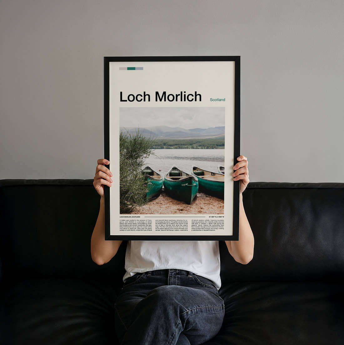 Loch Morlich Canoes On The Shore Travel Print held up by hand to show the size of the print