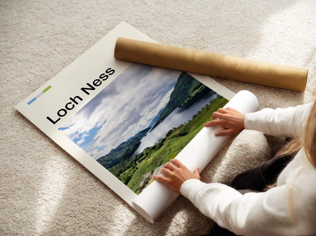 Loch Ness Green Hills And Loch Travel Print being unrolled from its postal tube