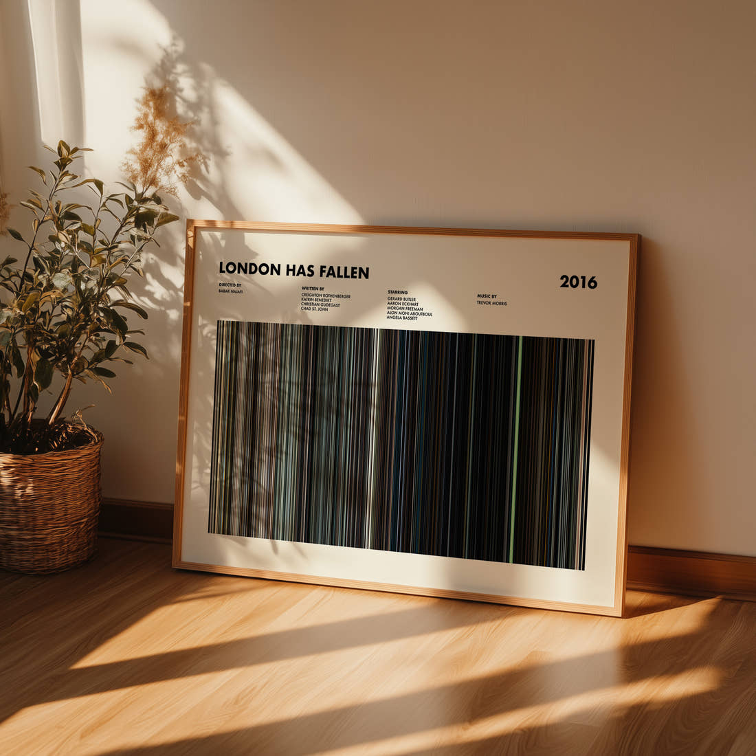 London Has Fallen Movie Barcode Poster framed and leaning against a wall on a wooden floor