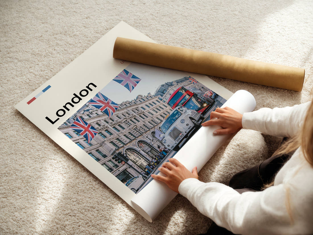 London Taxi Under Union Jacks Travel Print being unrolled from its postal tube