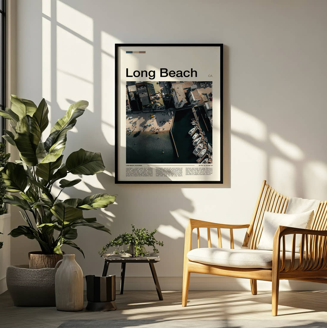 Long Beach Travel Print framed on a pale wall beside houseplants
