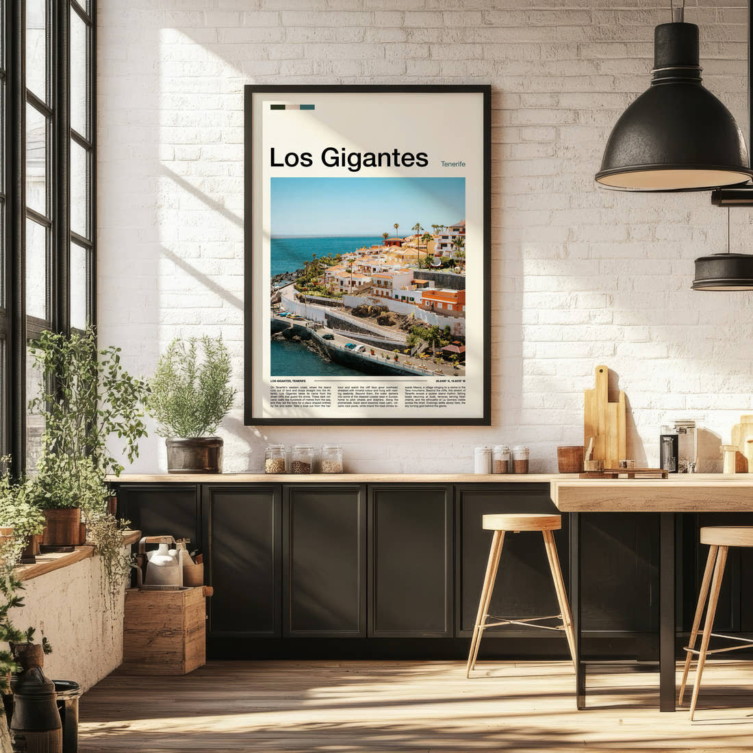 Los Gigantes Coastal Village Cliffs Travel Print framed on the wall of a bright kitchen and dining space
