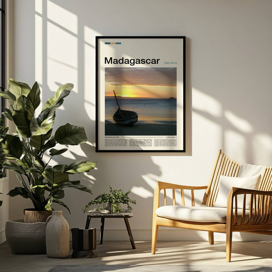 Madagascar Boat At Sunset Travel Print framed on a pale wall beside houseplants