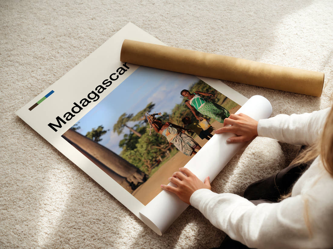 Madagascar People Walking By Baobabs Travel Print being unrolled from its postal tube