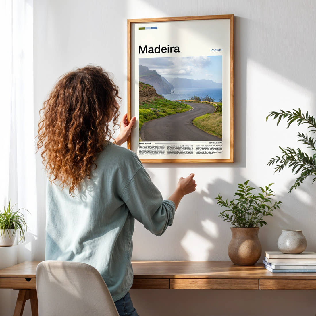 Madeira Winding Coastal Road Travel Print framed on a pale wall beside houseplants