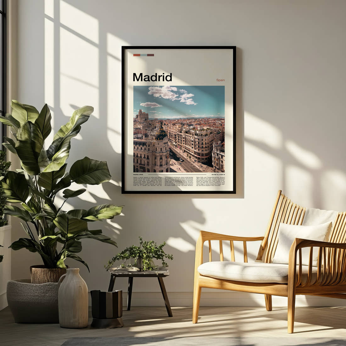 Madrid Gran Via Rooftops Travel Print framed on a pale wall beside houseplants