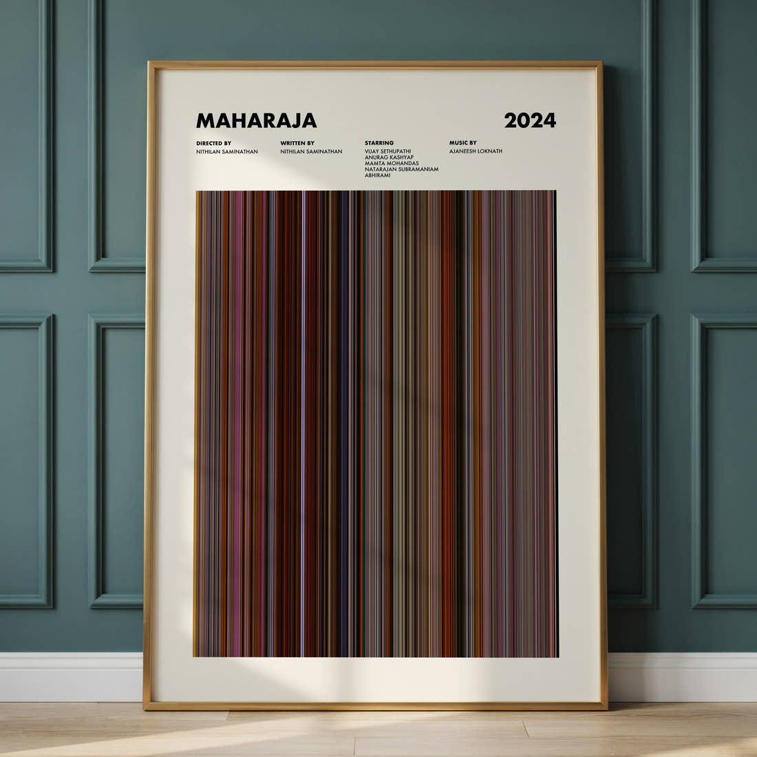 Maharaja Movie Barcode Poster framed and leaning against a panelled wall