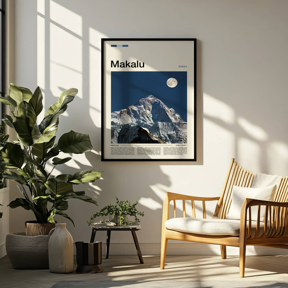 Makalu Moon Over Snowy Peak Travel Print framed on a pale wall beside houseplants