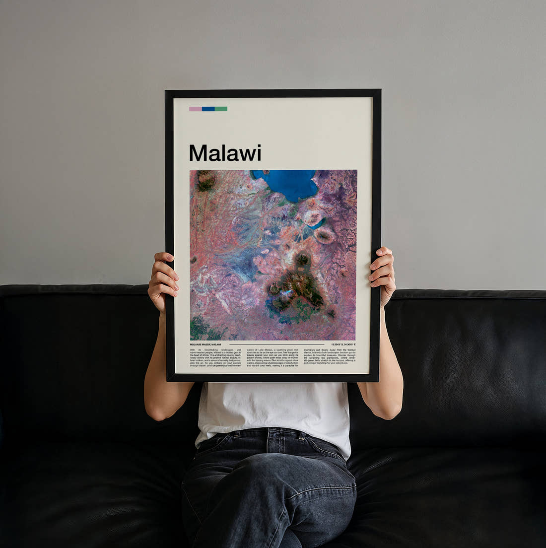 Malawi Colourful Rock Patterns Travel Print held up by hand to show the size of the print