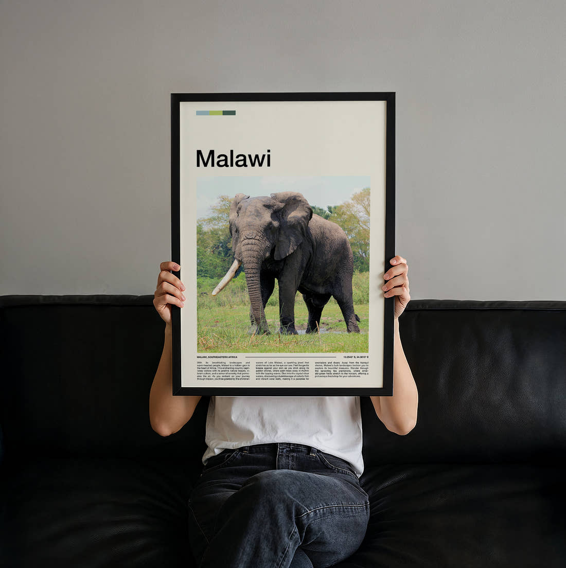 Malawi Elephant Travel Print held up by hand to show the size of the print