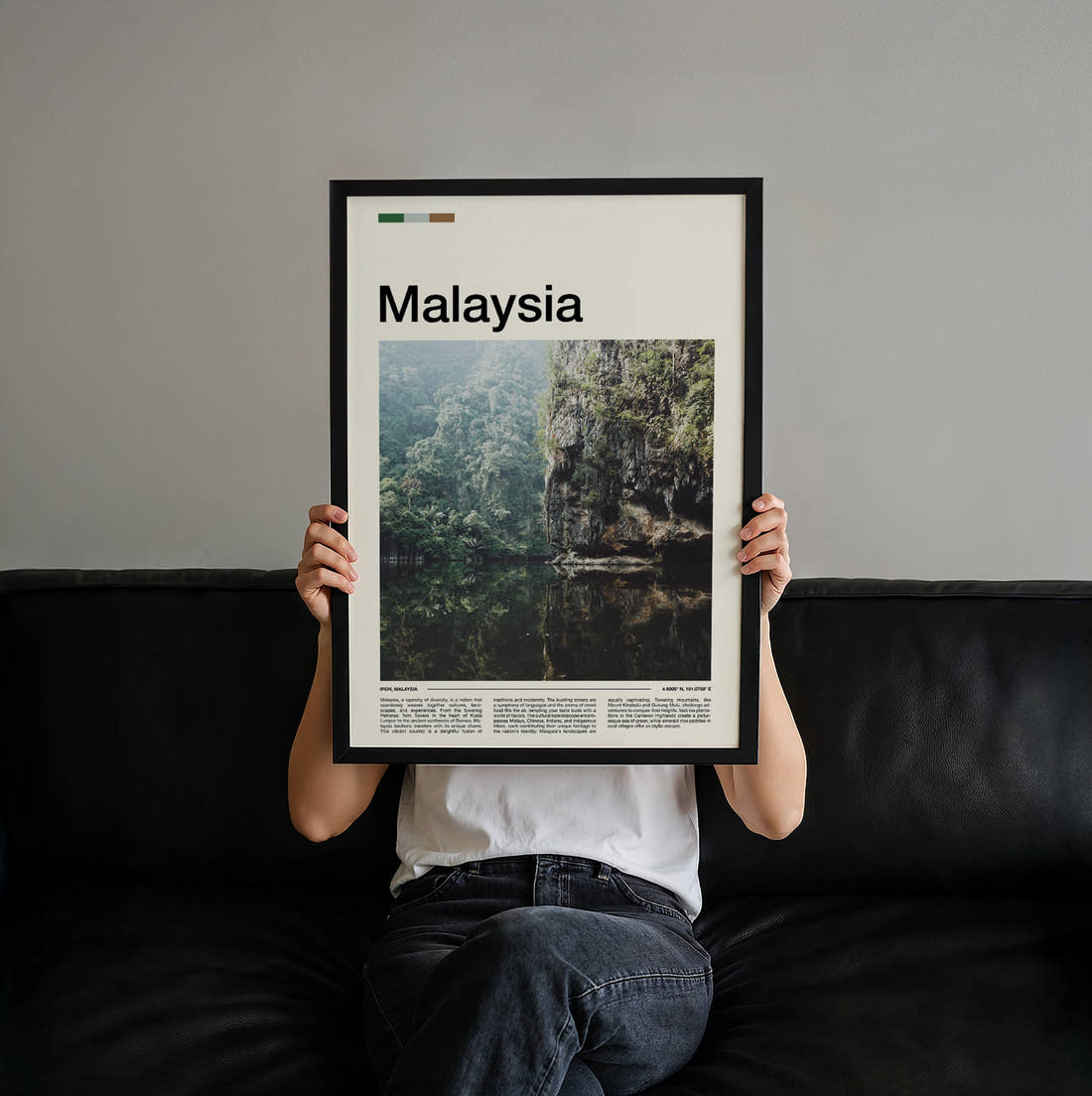 Malaysia Cliffs Reflected In Water Travel Print held up by hand to show the size of the print