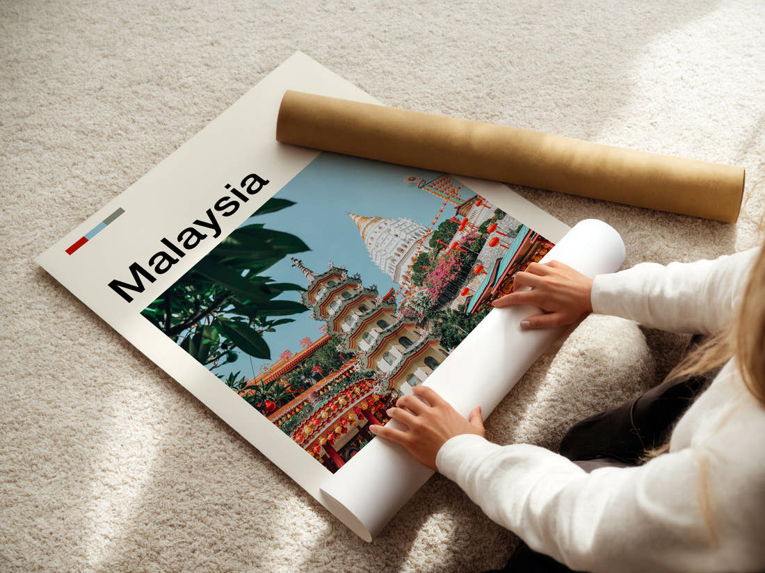 Malaysia Temple And Pagoda Travel Print being unrolled from its postal tube