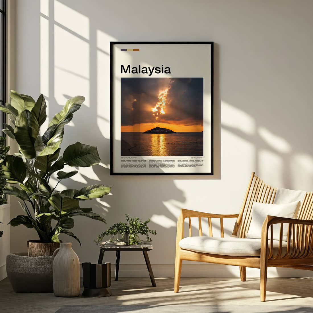 Malaysia Sunset Over Small Island Travel Print framed on a pale wall beside houseplants