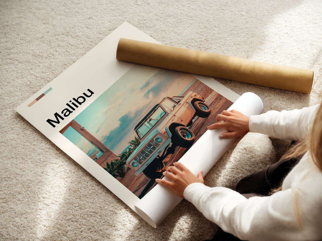 Malibu Vintage Pickup Truck Travel Print being unrolled from its postal tube