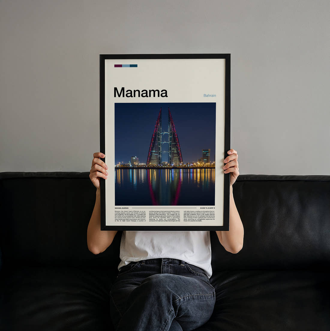 Manama Twin Towers At Night Travel Print held up by hand to show the size of the print