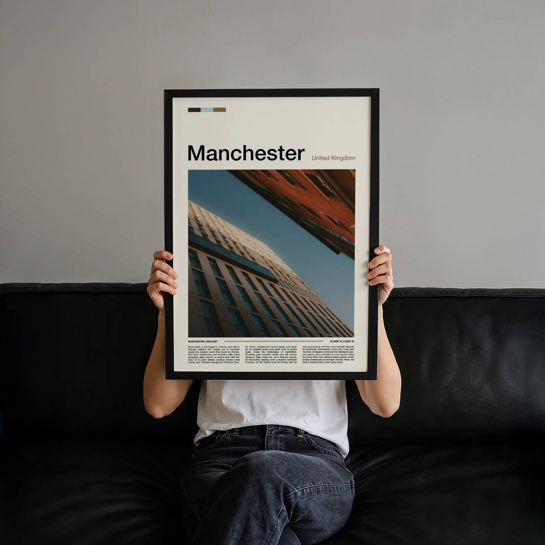 Manchester Upward Building Angle Travel Print held up by hand to show the size of the print