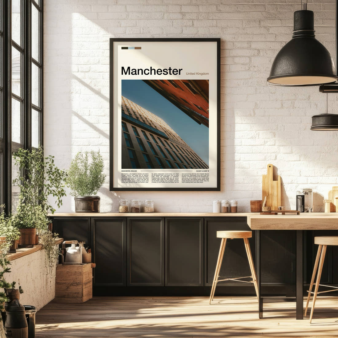 Manchester Upward Building Angle Travel Print framed on the wall of a bright kitchen and dining space