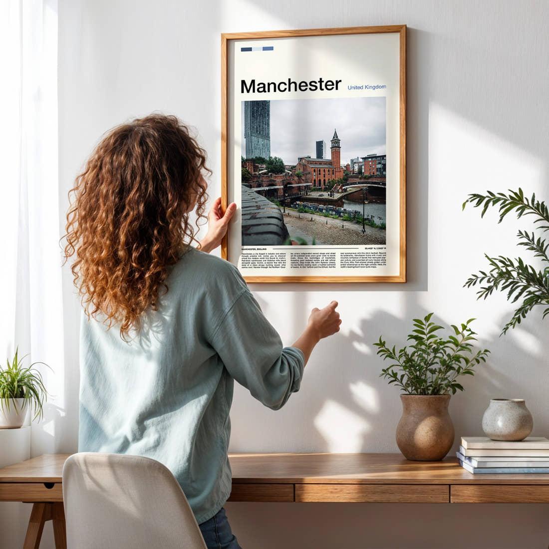 Manchester Castlefield Canal View Travel Print framed on a pale wall beside houseplants