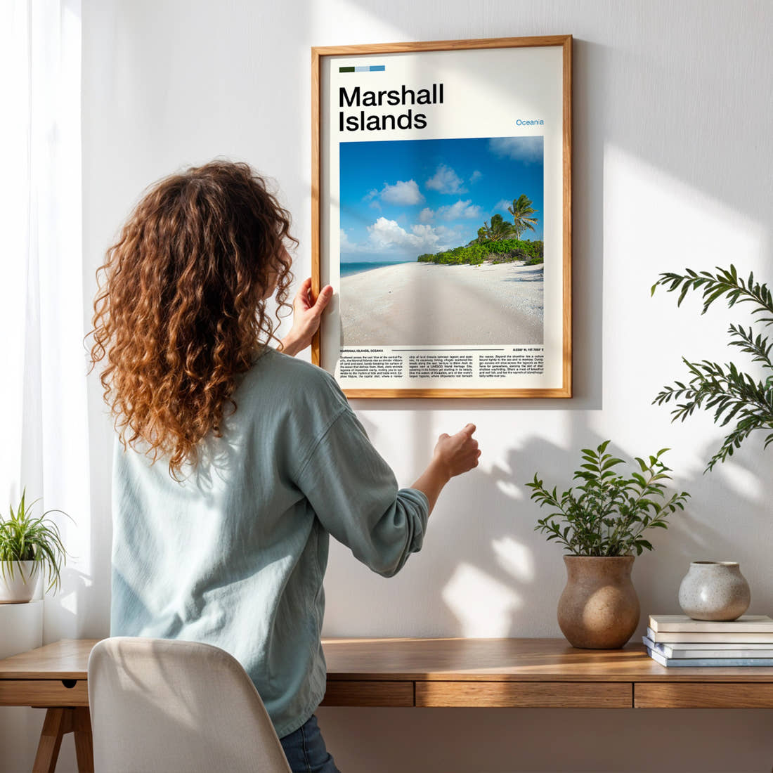 Marshall Islands Palm-Fringed Beach Travel Print framed on a pale wall beside houseplants
