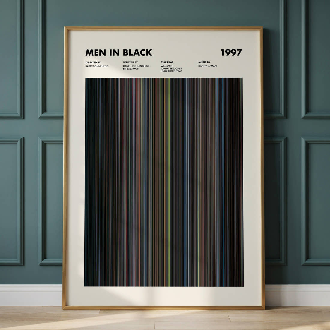 Men In Black Movie Barcode Poster framed and leaning against a panelled wall